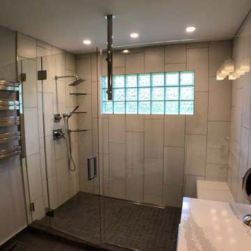 Bathroom remodel with large shower, separate water closet, towel warmer and more