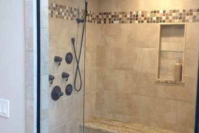 Example of a transitional alcove shower design in Cleveland
