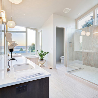 Example of a huge minimalist master porcelain tile and beige floor bathroom design in New York with dark wood cabinets, a two-piece toilet, white walls, an undermount sink, quartz countertops and white countertops
