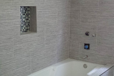 Example of a minimalist porcelain tile porcelain tile bathroom design in Los Angeles with an undermount sink and a two-piece toilet