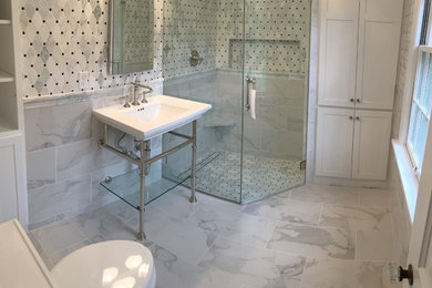 Example of a marble tile marble floor bathroom design in Milwaukee