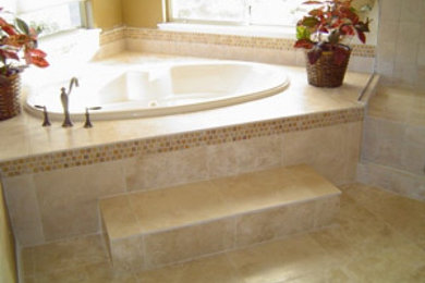 Large transitional master beige tile and ceramic tile ceramic tile corner bathtub photo in Phoenix with yellow walls