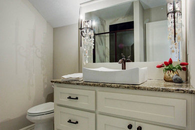 Example of a mid-sized transitional 3/4 white tile and ceramic tile corner shower design in Kansas City with shaker cabinets, white cabinets, a one-piece toilet, beige walls, a vessel sink and granite countertops