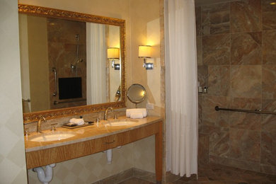 Example of a large tuscan master beige tile and porcelain tile ceramic tile doorless shower design in New York with an undermount sink, furniture-like cabinets, medium tone wood cabinets, granite countertops, a one-piece toilet and beige walls