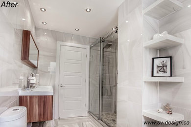モントリオールにある高級な中くらいなモダンスタイルのおしゃれなマスターバスルーム (レイズドパネル扉のキャビネット、大型浴槽、ダブルシャワー、グレーのタイル、セラミックタイル) の写真