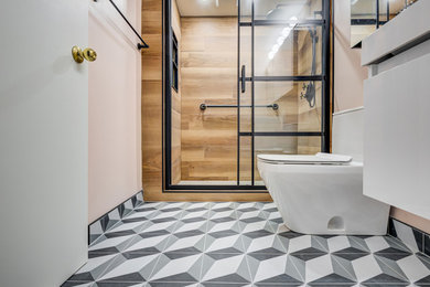 Example of a small country 3/4 porcelain tile, multicolored floor and single-sink bathroom design in Toronto with flat-panel cabinets, white cabinets, a one-piece toilet, quartz countertops, white countertops and a floating vanity