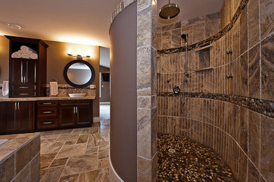 Bathroom - mid-sized modern multicolored tile beige floor bathroom idea in Other with shaker cabinets, brown cabinets, a one-piece toilet, brown walls, a vessel sink, granite countertops and beige countertops