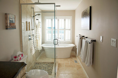 Example of a mid-sized minimalist beige tile beige floor bathroom design in Other with shaker cabinets, beige cabinets, a one-piece toilet, beige walls, a hinged shower door and black countertops