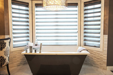 На фото: главная ванная комната среднего размера в современном стиле с фасадами в стиле шейкер, отдельно стоящей ванной, угловым душем, унитазом-моноблоком, коричневыми стенами и врезной раковиной