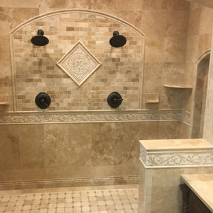 Inspiration for a large mediterranean master bathroom in New York with raised-panel cabinets, dark wood cabinets, a double shower, beige tile, travertine, beige walls, travertine floors, a vessel sink, tile benchtops, beige floor and an open shower.