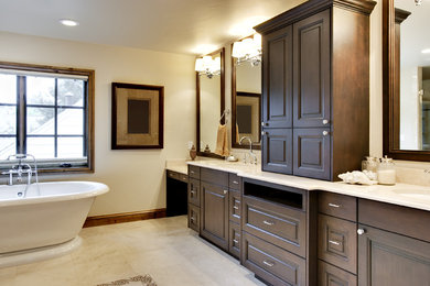 Bathroom - mid-sized craftsman master beige tile and porcelain tile ceramic tile bathroom idea in Ottawa with an undermount sink, raised-panel cabinets, dark wood cabinets, granite countertops, a two-piece toilet and white walls