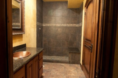 Alcove shower - mid-sized alcove shower idea in Kansas City with dark wood cabinets