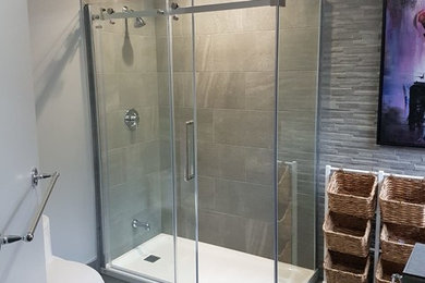 Bathroom shower wall and floor using marble, glass, ceramic and porcelain tiles
