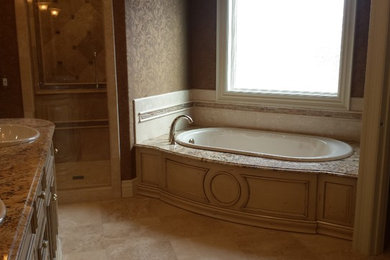 Large trendy master beige tile travertine floor bathroom photo in Other