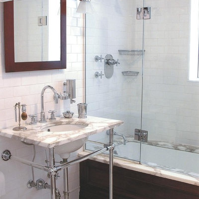 Inspiration for a mid-sized timeless master subway tile and white tile marble floor bathroom remodel in New York with a console sink, open cabinets, white walls and marble countertops