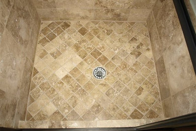 Inspiration for a mid-sized timeless beige tile and stone tile porcelain tile alcove shower remodel in Denver with tile countertops and beige walls