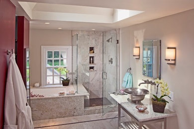 Mid-sized transitional master glass tile and gray tile ceramic tile corner shower photo in Philadelphia with a vessel sink, granite countertops, an undermount tub, a one-piece toilet and beige walls