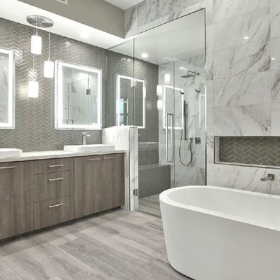 Bathroom - modern master gray tile and glass tile light wood floor bathroom idea in Phoenix with white walls, a pedestal sink, marble countertops, a hinged shower door and white countertops