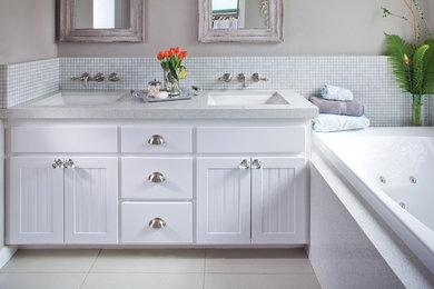 Inspiration for a mid-sized timeless corner bathtub remodel in Atlanta with white cabinets