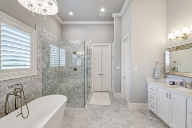 Bathroom - large contemporary master gray tile and stone slab marble floor and gray floor bathroom idea in Dallas with recessed-panel cabinets, white cabinets, gray walls, an undermount sink, quartz countertops and a hinged shower door