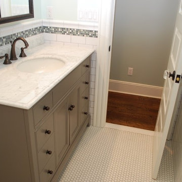 Bathroom vanity and mosaic tile floor