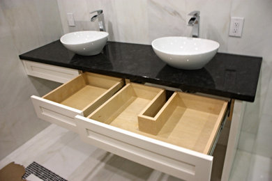 Example of a trendy bathroom design in Toronto with shaker cabinets and white cabinets