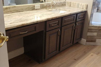 Bathroom - mid-sized transitional single-sink bathroom idea in Tampa with raised-panel cabinets and a built-in vanity