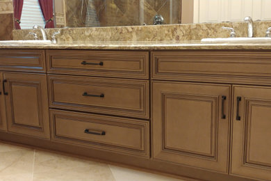 Bathroom - mid-sized modern master double-sink bathroom idea in Tampa with raised-panel cabinets, light wood cabinets and a built-in vanity