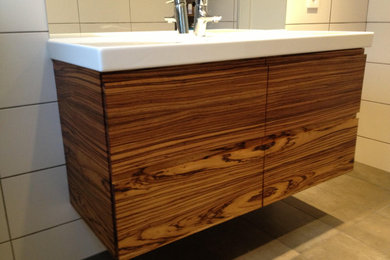 Bathroom with custom made African Zebrano Wood cabinet and floor heating