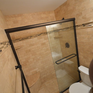 Bathroom with wall to wall tile and Kerdi line drain