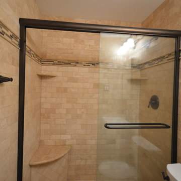 Bathroom with wall to wall tile and Kerdi line drain
