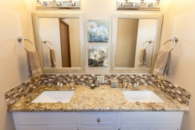 Mid-sized master beige tile and matchstick tile ceramic tile bathroom photo in Sacramento with an undermount sink, raised-panel cabinets, white cabinets, granite countertops and beige walls