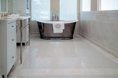 Example of a mid-sized classic master marble tile marble floor and white floor freestanding bathtub design in New York with beaded inset cabinets, white cabinets, beige walls, a console sink and white countertops