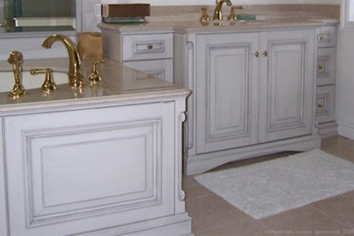 Inspiration for a beige tile marble floor bathroom remodel in Toronto with light wood cabinets and white walls