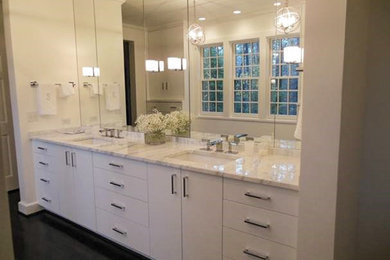 Example of a large classic master white tile dark wood floor bathroom design in Birmingham with an undermount sink, flat-panel cabinets, white cabinets, marble countertops, a one-piece toilet and white walls