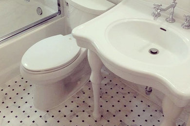 Transitional kids' white tile marble floor bathroom photo in New York with a console sink