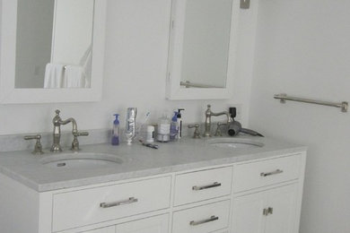 Example of a transitional master ceramic tile bathroom design in New York with an undermount sink, shaker cabinets, white cabinets and white walls