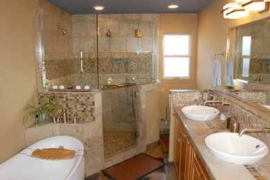Mid-sized transitional master pebble tile bathroom photo in Portland with recessed-panel cabinets, light wood cabinets, a one-piece toilet, yellow walls, a vessel sink and a hinged shower door