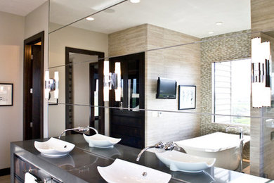 Freestanding bathtub - modern master freestanding bathtub idea in Other with a vessel sink, dark wood cabinets and beige walls