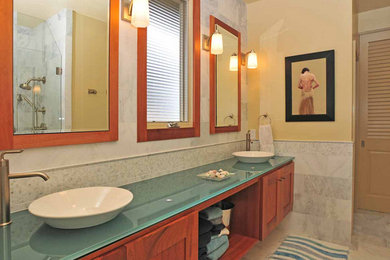 Bathroom - marble floor bathroom idea in San Diego with medium tone wood cabinets and yellow walls