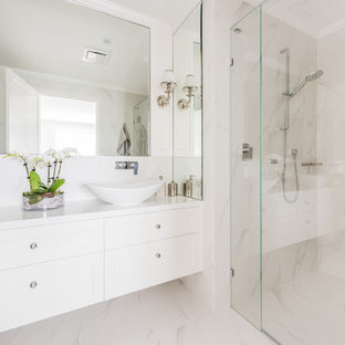 Design ideas for a transitional 3/4 bathroom in Melbourne with shaker cabinets, white cabinets, a corner shower, white walls, a vessel sink, beige floor, a hinged shower door and white benchtops.