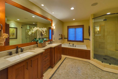 Beige tile bathroom photo in Salt Lake City with a trough sink, medium tone wood cabinets and beige walls