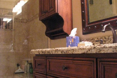 Mid-sized trendy 3/4 beige tile bathroom photo in Sacramento with dark wood cabinets and granite countertops