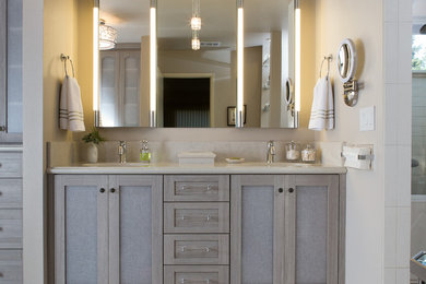 Example of a trendy master porcelain tile bathroom design in Sacramento with recessed-panel cabinets, light wood cabinets, marble countertops and gray walls