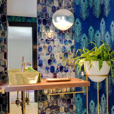 Large eclectic blue tile bathroom photo in Boston with blue walls, a vessel sink, wood countertops and brown countertops
