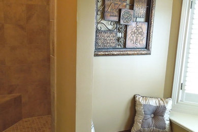Example of a master beige tile doorless shower design in Other