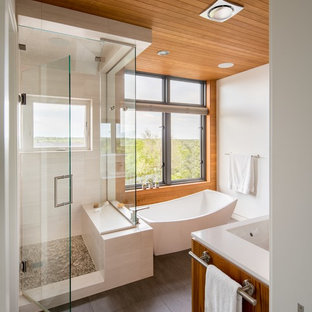 Mid-sized asian master porcelain tile and brown floor bathroom photo in Denver with a two-piece toilet, white walls, an undermount sink and a hinged shower door