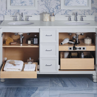 This is an example of a traditional master bathroom in Milwaukee with an undermount sink, white cabinets, blue tile, multi-coloured walls, marble floors, stone tile and recessed-panel cabinets.