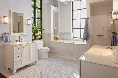 Example of a mid-sized classic master white tile and subway tile marble floor and gray floor alcove shower design in St Louis with white cabinets, an undermount tub, a two-piece toilet, white walls, an integrated sink, quartz countertops, a hinged shower door and flat-panel cabinets