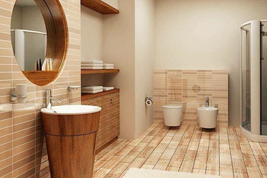 Example of a minimalist beige tile alcove shower design in Other with furniture-like cabinets, medium tone wood cabinets, a wall-mount toilet, beige walls and a pedestal sink